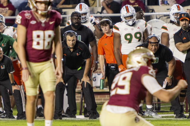 In the second half of the seven-point loss against Florida State University, Head Coach Mario Cristobal watches the FSU kicker and holder intently before they extend their lead.
