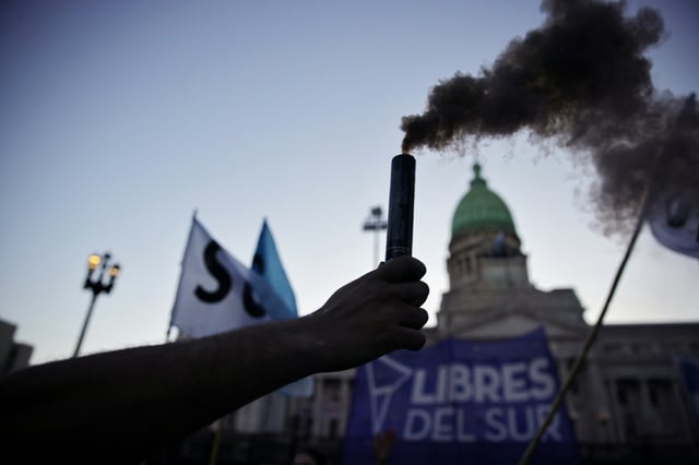 Demonstrators celebrated outside Argentina's Congress after senators overruled President Javier Milei's veto of spending increases for public universities and pediatric care