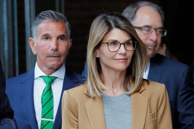 Actor Lori Loughlin, and her husband, fashion designer Mossimo Giannulli, leave the federal courthouse after facing charges in a nationwide college admissions cheating scheme, in Boston on April 3, 2019.