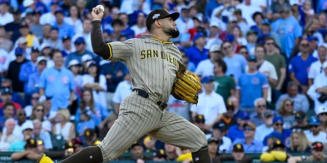 Oct 1, 2025; Chicago, Illinois, USA; San Diego Padres relief pitcher Robert Suarez (75) delivers a pitch against the Chicago Cubs in the ninth inning during game two of the Wildcard round for the 2025 MLB playoffs at Wrigley Field. Mandatory Credit: Matt Marton-Imagn Images