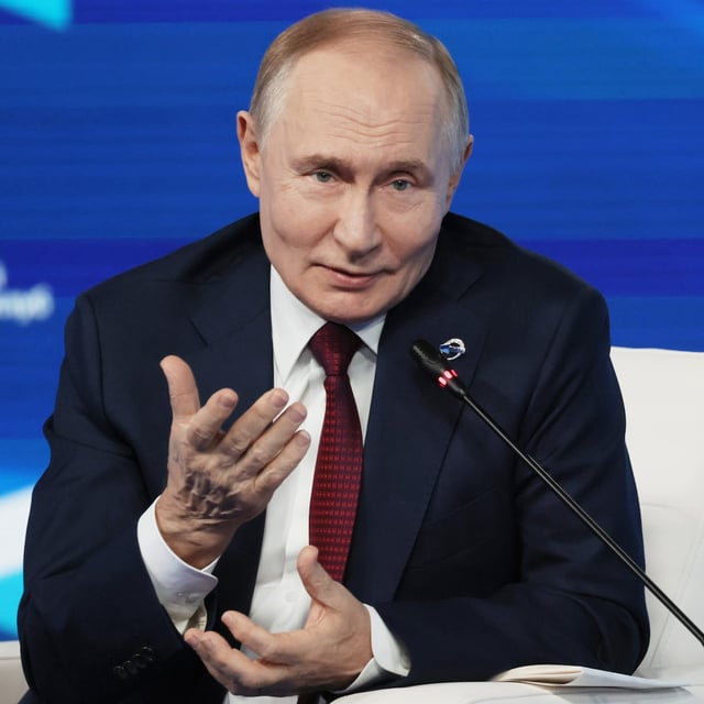 Russian President Vladimir Putin gestures as he answers questions during a meeting with foreign policy experts at the Valdai Discussion Club in the Black Sea resort of Sochi, Russia, on Thursday, Oct. 2, 2025. (Mikhail Metzel, Sputnik, Kremlin Pool Photo via AP)