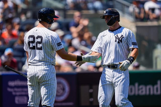 New York Yankees' Paul Goldschmidt (48) celebrates with New York Yankees' Ben Rice (22) after scoring during the first inning of a baseball game against the Houston Astros, Saturday, Aug. 9, 2025, in New York. (AP Photo/Yuki Iwamura)