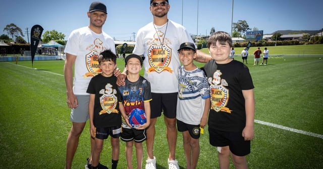 Judd Roberts, Rome Smith, Theo Tighe and Izaiah Chatfield couldn't wipe the smiles off their faces as they pose with Moree born-NRL player Tyrone Munro (left) and superstar Latrell Mitchell at a special coaching clinic for out-of-home care children. Picture by Peter Hardin