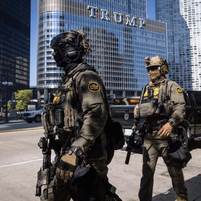 Federal agents from U.S. Immigration and Customs Enforcement and U.S. Customs and Border Protection walk along West Wacker Drive in the Loop, Sunday, Sept. 28, 2025, in Chicago. (Ashlee Rezin/Chicago Sun-Times via AP){p}{/p}