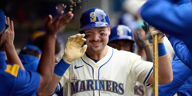 Sep 14, 2025; Seattle, Washington, USA;  Seattle Mariners catcher Cal Raleigh (29) is greeted in the dugout after hitting a two-run home against the Los Angeles Angels in the first inning at T-Mobile Park. Mandatory Credit: John Froschauer-Imagn Images