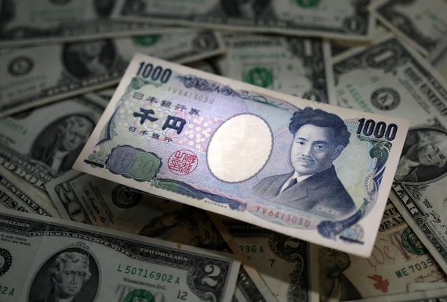 Japanese Yen and U.S. dollar banknotes are seen in this illustration taken March 10, 2023. REUTERS/Dado Ruvic/Illustration
