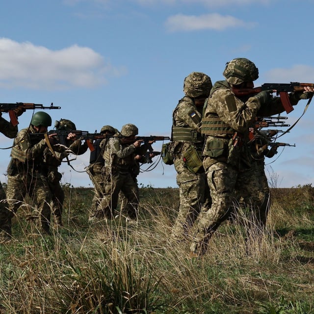 In this photo provided by Ukraine's 65th Mechanized Brigade press service, recruits run drills at a training ground in the Zaporizhzhia region, Ukraine, Friday, Sept. 26, 2025. (Andriy Andriyenko/Ukraine's 65th Mechanized Brigade via AP)