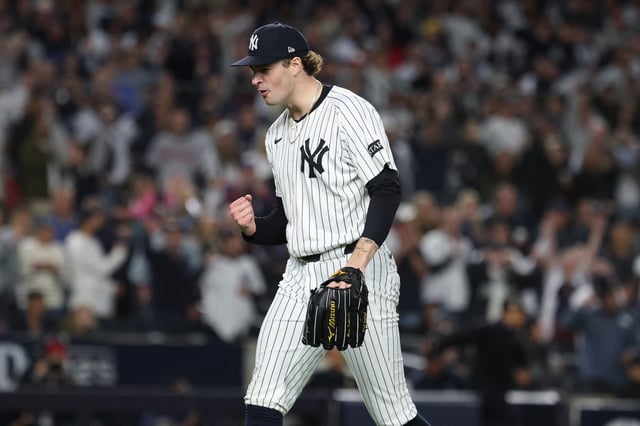 Oct 2, 2025; Bronx, New York, USA; New York Yankees pitcher Cam Schlittler (31) pumps his fist as he leaves the field after pitching the eighth inning against the Boston Red Sox during game three of the Wildcard round for the 2025 MLB playoffs at Yankee Stadium. Mandatory Credit: Vincent Carchietta-Imagn Images