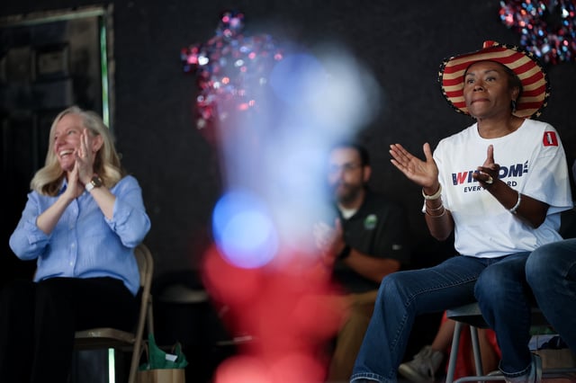 BUENA VISTA, VIRGINIA - SEPTEMBER 01: Virginia Republican gubernatorial candidate, Lt. Gov. Winsome Earle-Sears (R), and Virginia Democratic gubernatorial candidate, former Rep. Abigail Spanberger (L), wait to speak at the 54th Annual Buena Vista Labor Day Festival on September 01, 2025 in Buena Vista, Virginia. The Commonwealth of Virginia will hold its off-year election for governor and other statewide offices on November 4. (Photo by Win McNamee/Getty Images)