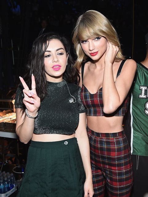 NEW YORK, NY - DECEMBER 12:  Charli XCX and Taylor Swift pose backstage at iHeartRadio Jingle Ball 2014, hosted by Z100 New York and presented by Goldfish Puffs at Madison Square Garden on December 12, 2014 in New York City.  (Photo by Dimitrios Kambouris/Getty Images for iHeartMedia)
