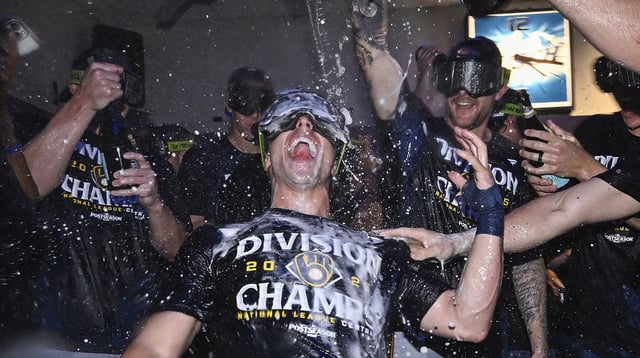 Sep 21, 2025; St. Louis, Missouri, USA; Milwaukee Brewers right fielder Sal Frelick (10) is showered with champagne and beer as he celebrates with his teammates after the Brewers clinched the 2025 National League Central Division Championship following a game against the St. Louis Cardinals at Busch Stadium. Mandatory Credit: Jeff Curry-Imagn Images