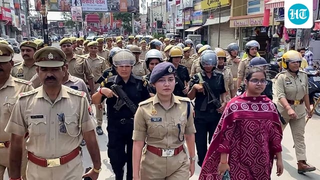Bareilly SP South Anshika Verma leads a flag march in a sensitive area of the district on Thursday