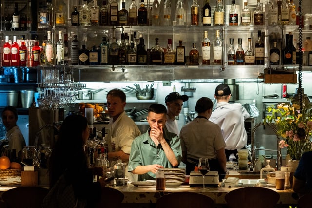 Employees work in the open kitchen of a restaurant in the Patriarch's Ponds neighbourhood in central Moscow, Russia July 11, 2025. REUTERS/Maxim Shemetov