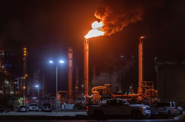 Flames rise from the Chevron refinery in El Segundo, Calif., Thursday, October 2, 2025.