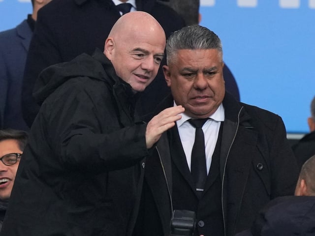 FIFA President Gianni Infantino, left, talks with Argentine Football Association President Claudio Tapia during the FIFA U-20 World Cup final soccer match at the Diego Maradona stadium in La Plata, Argentina, Sunday, June 11, 2023. (AP Photo/Natacha Pisarenko)