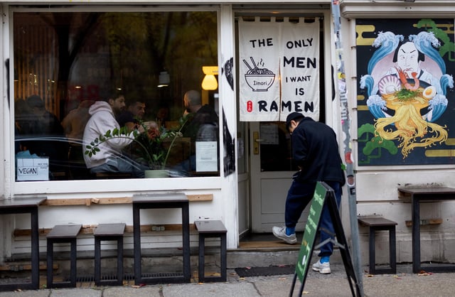 A person enters an Asian restaurant at Scheunenviertel quarter in Berlin, Germany, November 15, 2024. REUTERS/Lisi Niesner