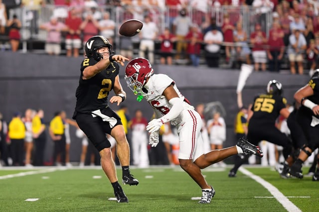 Vanderbilt Commodores quarterback Diego Pavia scrambles vs the Alabama Crimson Tide