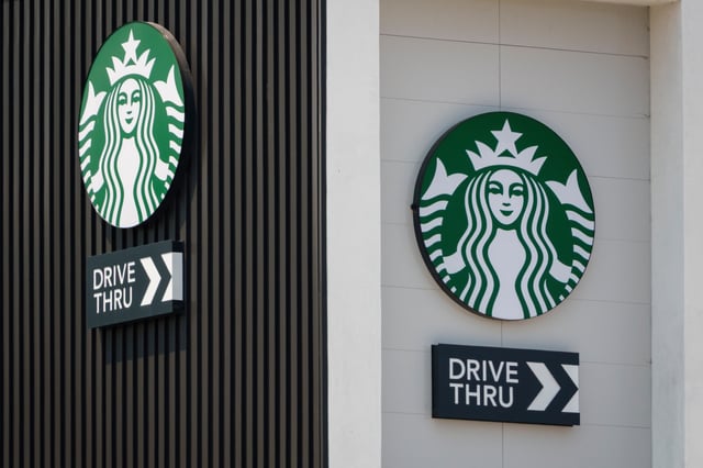 SAN DIEGO, CALIFORNIA - AUGUST 2: The Starbucks logo is displayed outside one of their coffee shops on August 2, 2025 in San Diego, California. (Photo by Kevin Carter/Getty Images)