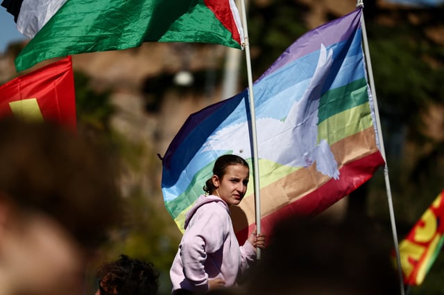 A pro-Palestinian demonstrator attends a protest during a nationwide strike called by the USB union to condemn the Israeli forces' interception of the vessels of the Global Sumud Flotilla aiming to reach Gaza and break Israel's naval blockade, in Rome, Italy, October 3, 2025. REUTERS/Yara Nardi