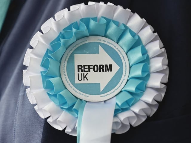 Reform UK rosette pinned to a suit jacket. Picture: Shutterstock/Sean Aidan Calderbank