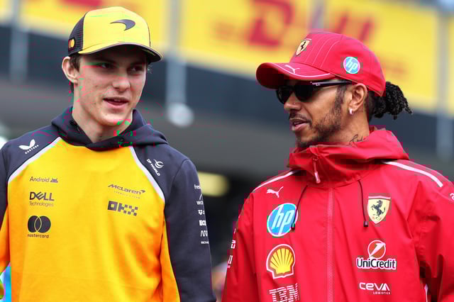 BAKU, AZERBAIJAN - SEPTEMBER 21: Oscar Piastri of Australia and McLaren and Lewis Hamilton of Great Britain and Scuderia Ferrari talk in the Paddock prior to the F1 Grand Prix of Azerbaijan at Baku City Circuit on September 21, 2025 in Baku, Azerbaijan. (Photo by Mark Thompson/Getty Images)