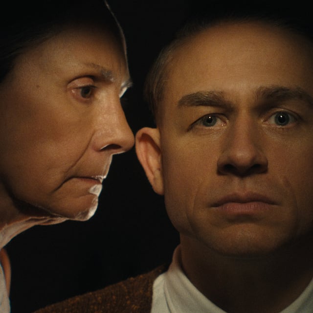 augusta gein talks in her son ed's ear in a still from monster the ed gein story