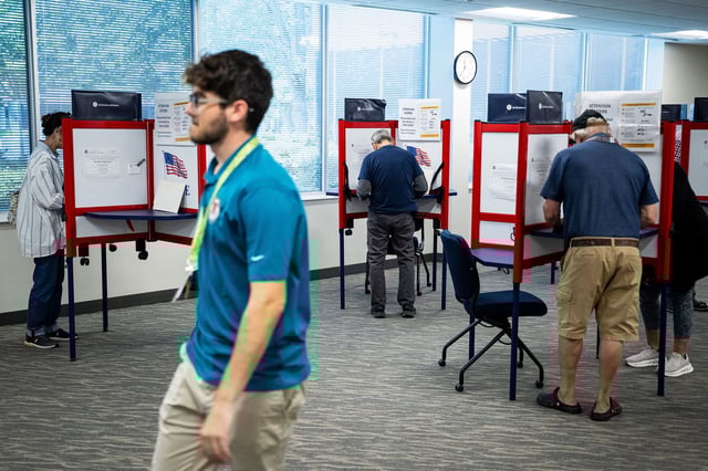 Voters cast ballots at the Loudoun County Office of Elections and Voter Registration in Leesburg, Virginia, on September 19, the first day of early voting.