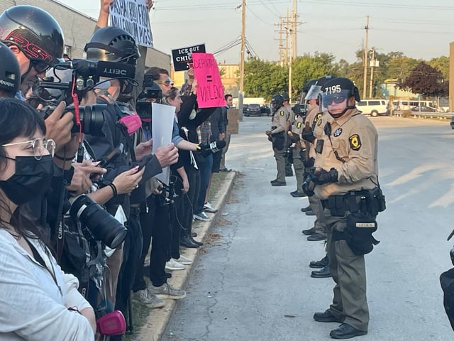 Protesters and law enforcement standoff outside the U.S. Immigration and Customs Enforcement holding facility in Broadview, Oct. 3, 2025.  (Stacey Wescott/Chicago Tribune)