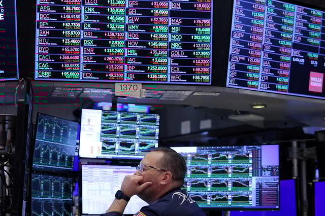 A trader works on the trading floor at the New York Stock Exchange (NYSE) in New York City, U.S., April 4, 2024. REUTERS/Andrew Kelly/File Photo