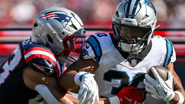 Sep 28, 2025; Foxborough, Massachusetts, USA; New England Patriots linebacker Christian Elliss (53) tackles Carolina Panthers running back Chuba Hubbard (30) during the second half at Gillette Stadium. Mandatory Credit: Brian Fluharty-Imagn Images