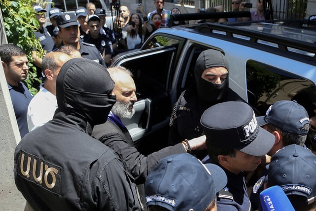 Armenia's National Security officers arrest Archbishop of the Armenian Apostolic Church Bagrat Galstanyan, who is charged with attempting to overthrow the government and destabilizing the state, in Yerevan, Armenia, June 25, 2025. Melik Baghdasaryan/Photolure via REUTERS