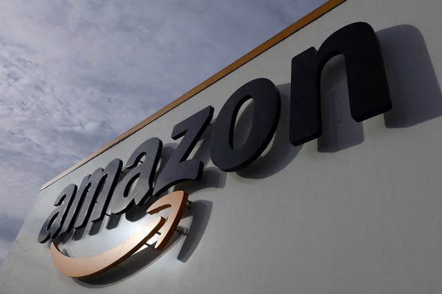 The logo of Amazon is seen at the company logistics center in Lauwin-Planque, northern France, November 15, 2022.  REUTERS/Pascal Rossignol/File Photo