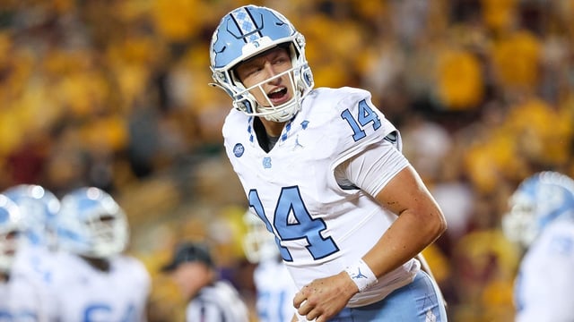 Aug 29, 2024; Minneapolis, Minnesota, USA; North Carolina Tar Heels quarterback Max Johnson (14) celebrates his rushing touchdown against the Minnesota Golden Gophers during the first half at Huntington Bank Stadium. Mandatory Credit: Matt Krohn-Imagn Images