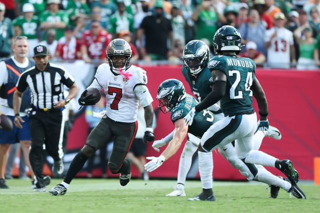 Sep 28, 2025; Tampa, Florida, USA; Tampa Bay Buccaneers running back Bucky Irving (7) runs the ball during the second half against the Philadelphia Eagles at Raymond James Stadium. Mandatory Credit: Kim Klement Neitzel-Imagn Images