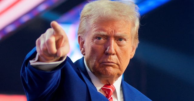 FILE PHOTO: U.S. President-elect Donald Trump gestures at Turning Point USA's AmericaFest in Phoenix, Arizona, U.S., December 22, 2024. REUTERS/Cheney Orr/File Photo
