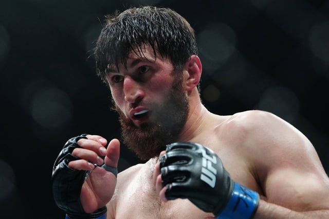 Mar 8, 2025; Las Vegas, Nevada, USA; Magomed Ankalaev (blue gloves) fights Alex Pereira (not pictured) during UFC 313 at T-Mobile Arena. Mandatory Credit: Stephen R. Sylvanie-Imagn Images