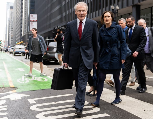 Former Illinois House Speaker Michael Madigan leaves Dirksen U.S. Courthouse after being sentenced to 7 1/2 years in prison and fined $2.5 million during his post-trial sentencing hearing, June 13, 2025, in downtown Chicago. He's trailed by daughter Nicole. (Audrey Richardson/Chicago Tribune)