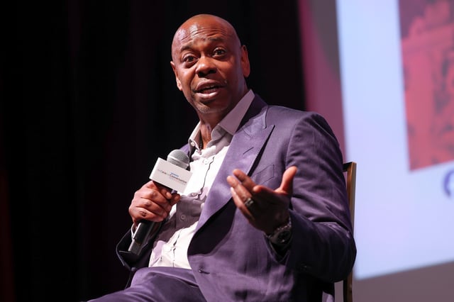 MARTHA'S VINEYARD, MASSACHUSETTS - AUGUST 08: Dave Chappelle speaks at the premiere of "Dave Chappelle: Live In Real Life" benefitting the Duke Ellington School of the Arts during the 2025 Martha's Vineyard African American Film Festival at Martha's Vineyard Performing Arts Center on August 08, 2025 in Martha's Vineyard, Massachusetts. (Photo by Arturo Holmes/Getty Images)