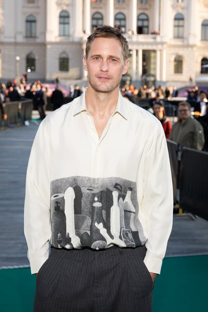 Alexander Skarsgard poses his dildo adored shirt at the 'Pillion' photocall during the 21st Zurich Film Festival on 1 October.(Andreas Rentz/Getty Images for ZFF)