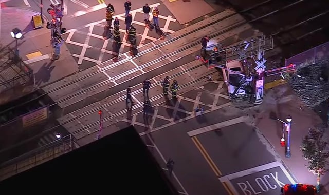 Police on the scene after a NJ Transit train collided with a car in Bergen County early Friday. (ABC7)