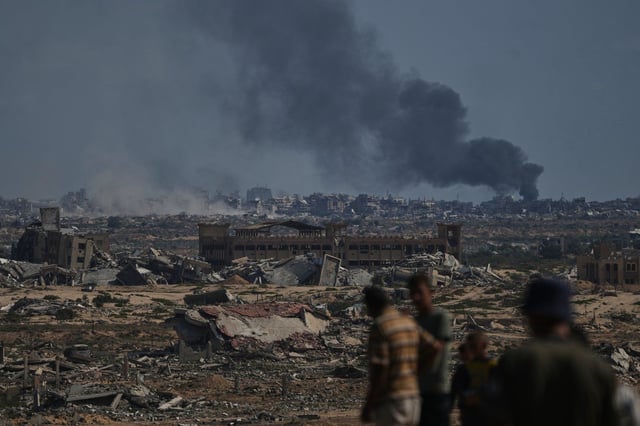 Smoke rises to the sky following an Israeli military strike in Gaza City, as seen from the central Gaza Strip, Thursday, Oct. 2, 2025. (AP Photo/Abdel Kareem Hana)