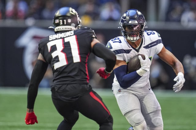 Oct 20, 2024; Atlanta, Georgia, USA; Seattle Seahawks tight end Noah Fant (87) runs against Atlanta Falcons safety Justin Simmons (31) during the first half at Mercedes-Benz Stadium. Mandatory Credit: Dale Zanine-Imagn Images/ File Photo