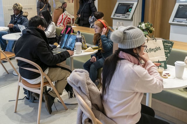 Young adults get online at a co-working space and cafe in New York City’s Herald Square. 