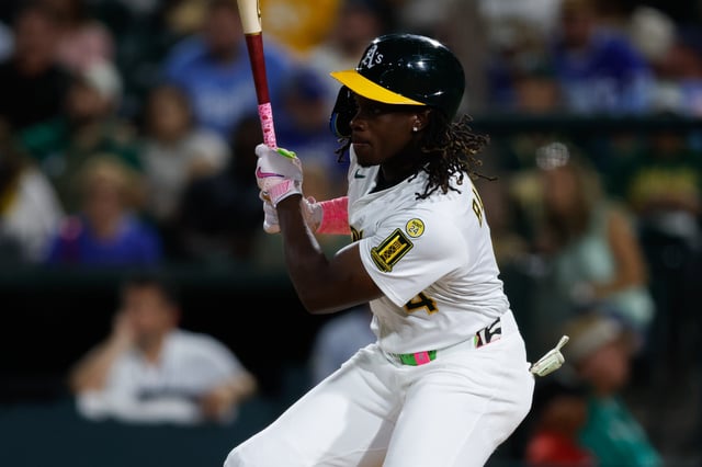 Sep 26, 2025; West Sacramento, California, USA; Athletics center fielder Lawrence Butler (4) hits a single during the first inning against the Kansas City Royals at Sutter Health Park. Mandatory Credit: Sergio Estrada-Imagn Images/ File Photo