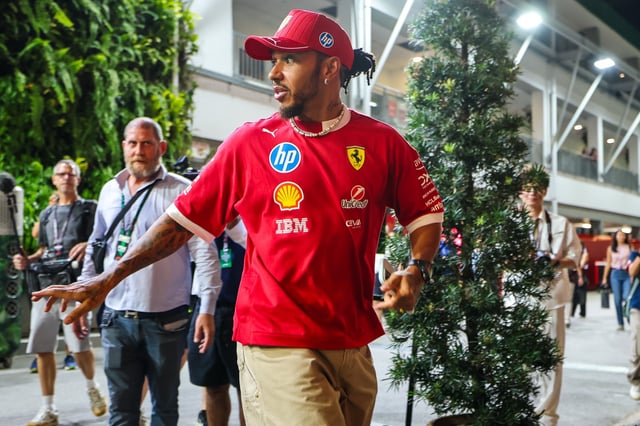 SINGAPORE, SINGAPORE - SEPTEMBER 25: Lewis Hamilton of Great Britain and Scuderia Ferrari walks in the paddock during previews ahead of the F1 Grand Prix of Singapore at Marina Bay Street Circuit on September 25, 2025 in Singapore, Singapore. (Photo by Kym Illman/Getty Images)