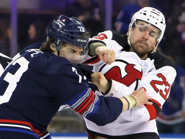 Kurtis MacDermid (right), then of the New Jersey Devils, fights with Matt Rempe of the New York Rangers during an NHL game on April 3, 2024 in New York.