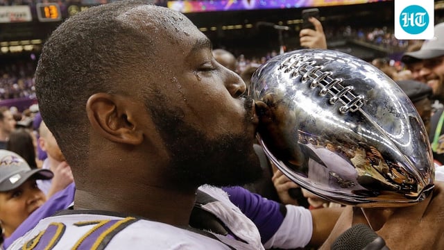 Baltimore Ravens defensive end Arthur Jones (97) kisses the Vince Lombardi Trophy after defeating the San Francisco 49ers 