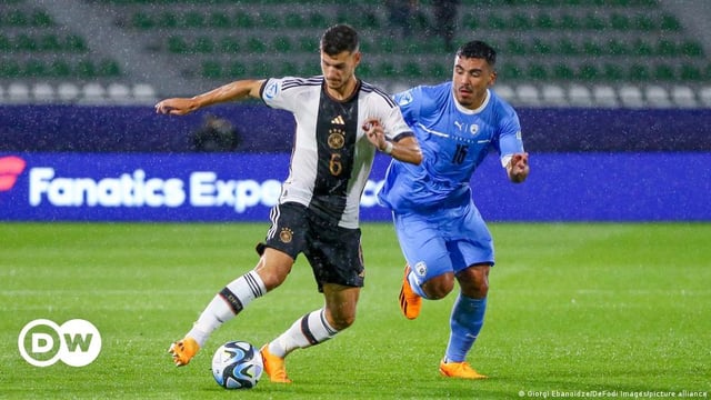 Tom Krauss (Germany) and Eitan Azulay (Israel) battle for the ball as Germany's under-21's play Israel's in the European Championships in Kutaisi, Georgia. June 22, 2023.