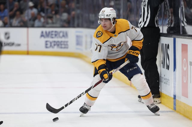 Apr 10, 2025; Salt Lake City, Utah, USA; Nashville Predators right wing Luke Evangelista (77) skates with the puck against the Utah Hockey Club during the first period at Delta Center. Mandatory Credit: Rob Gray-Imagn Images