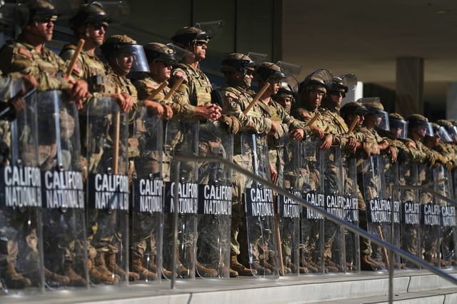 California National Guard members are positioned at the federal building in downtown Los Angeles on June 10, 2025.